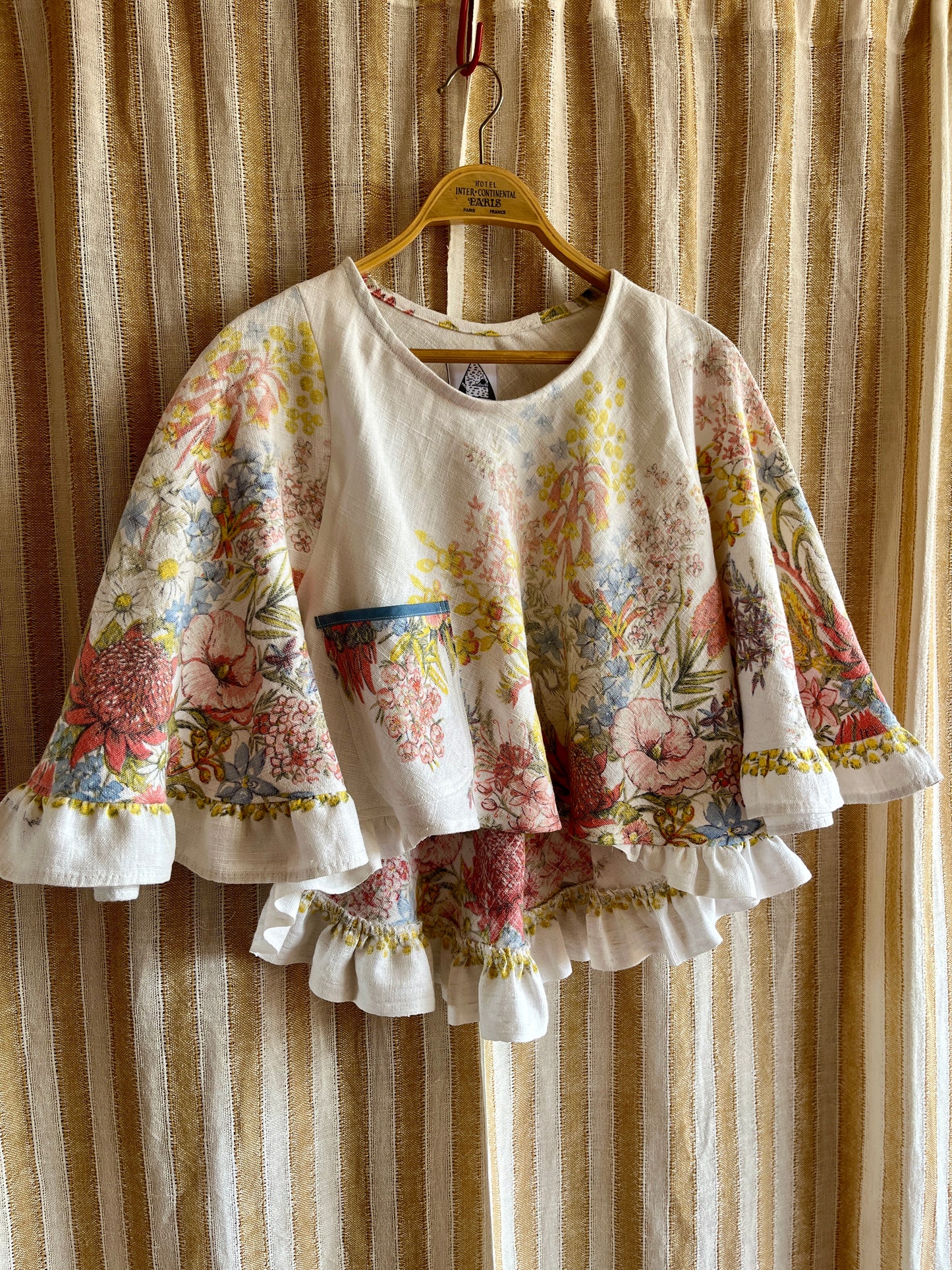 Circular and diagonal cut linen blouse